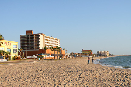 A couple takes a walk at Corpus Christi Beach