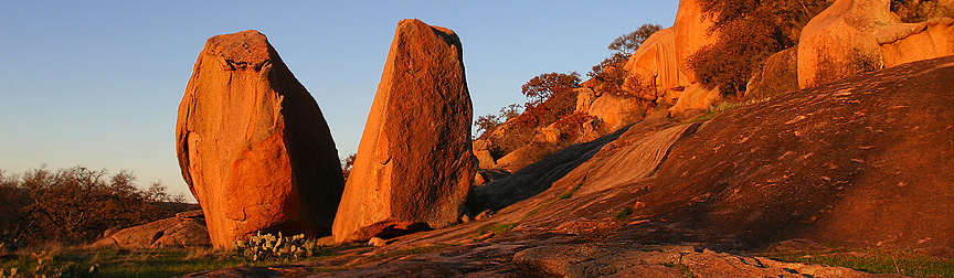 Early morning light illuminates these large boulders at Enchanted Rock. Image #7