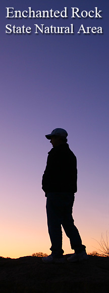 Hiker at sunrise at Enchanted Rock. Image #3