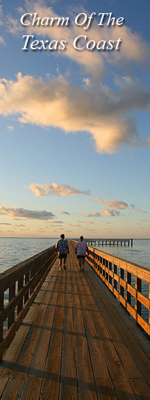 A couple takes a stroll on the pier at Rockport Beach Park