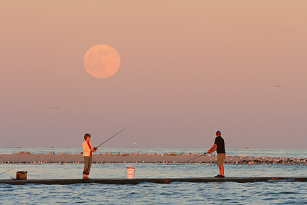 Photo #5, People fishing as the full moon rises, South Jetty Galveston