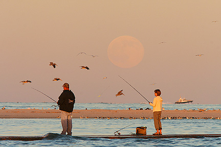 Photo #4, People fishing as the full moon rises, South Jetty Galveston