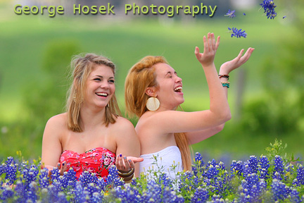 Girls gets their picture taken with Bluebonnets in Brenham Texas. 
